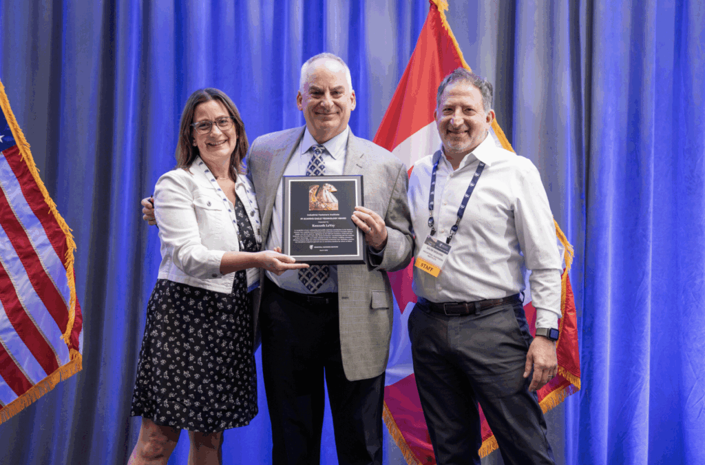 Three people at IFI's Annual Spring Conference